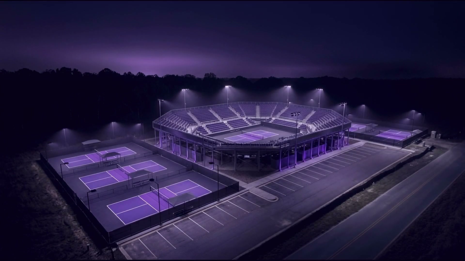 A championship pickleball complex lit at night